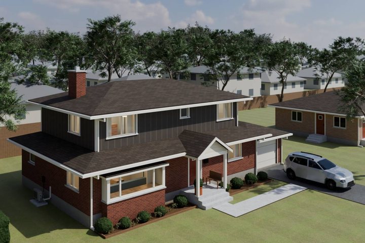 3D model of the finished house: a grey board-and-batten second storey over the red-brick first floor.
